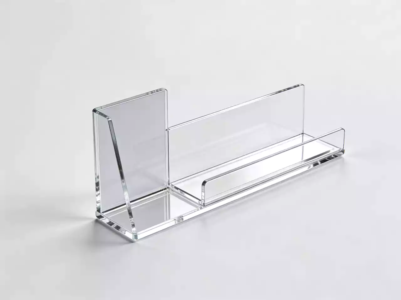 Clear acrylic shelf trays for organized retail display