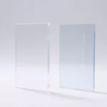 Side-by-side comparison of clear acrylic and polycarbonate sheets showing optical clarity differences