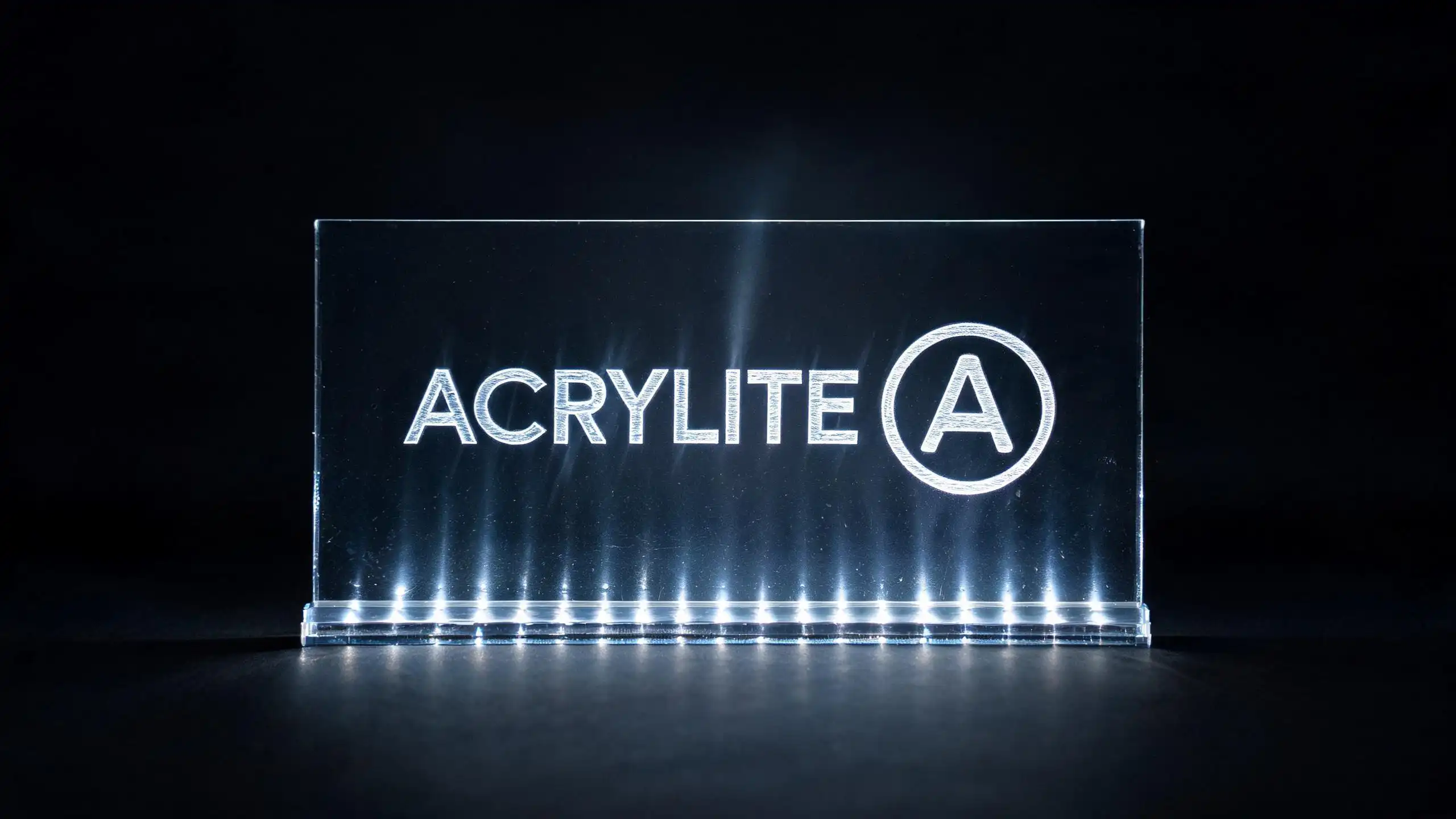 Edge-lit acrylic panel with laser-engraved text illuminated by LED strip